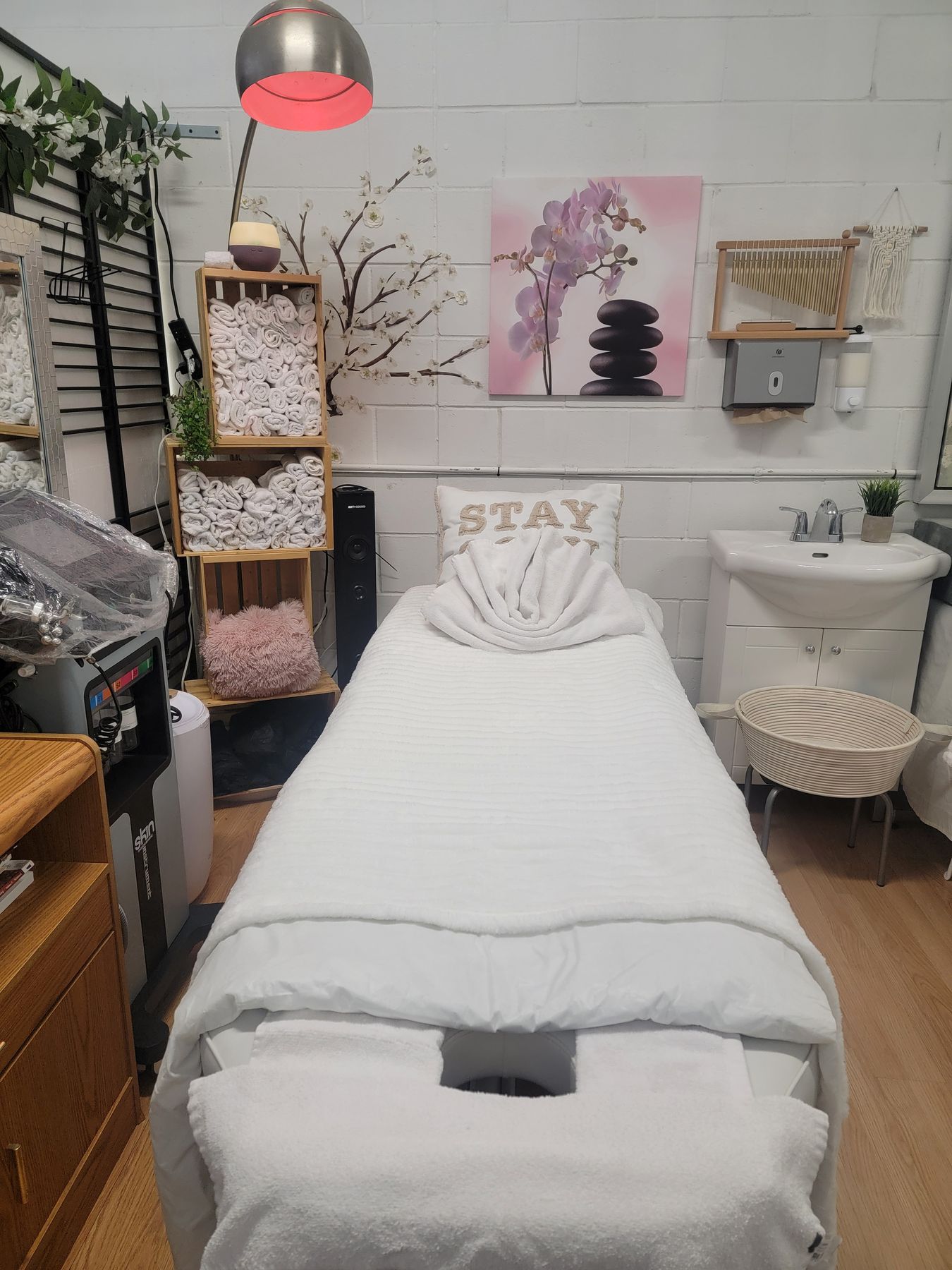 Massage table with face cradle made up in white