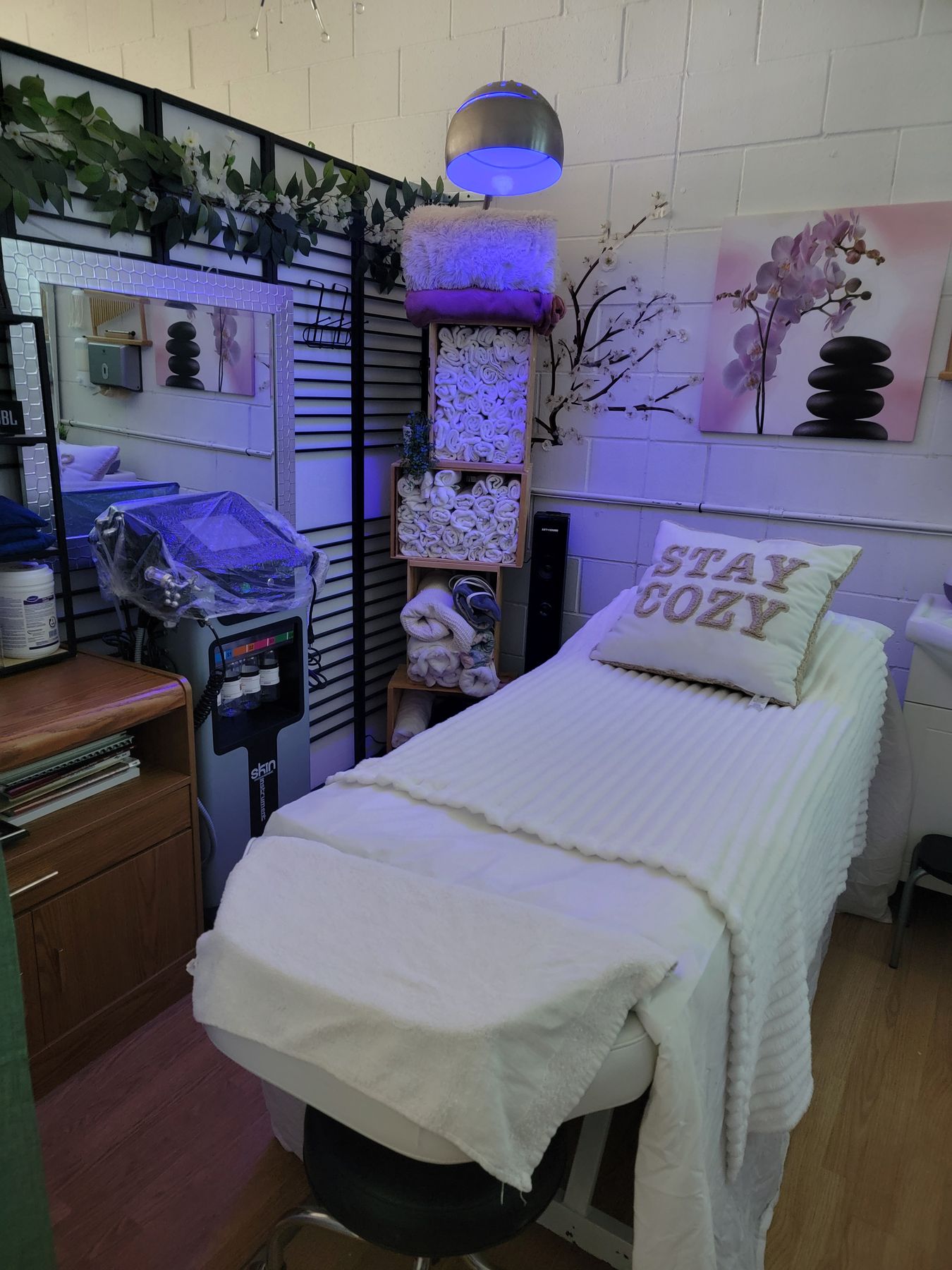 Spa treatment room in soft purple light