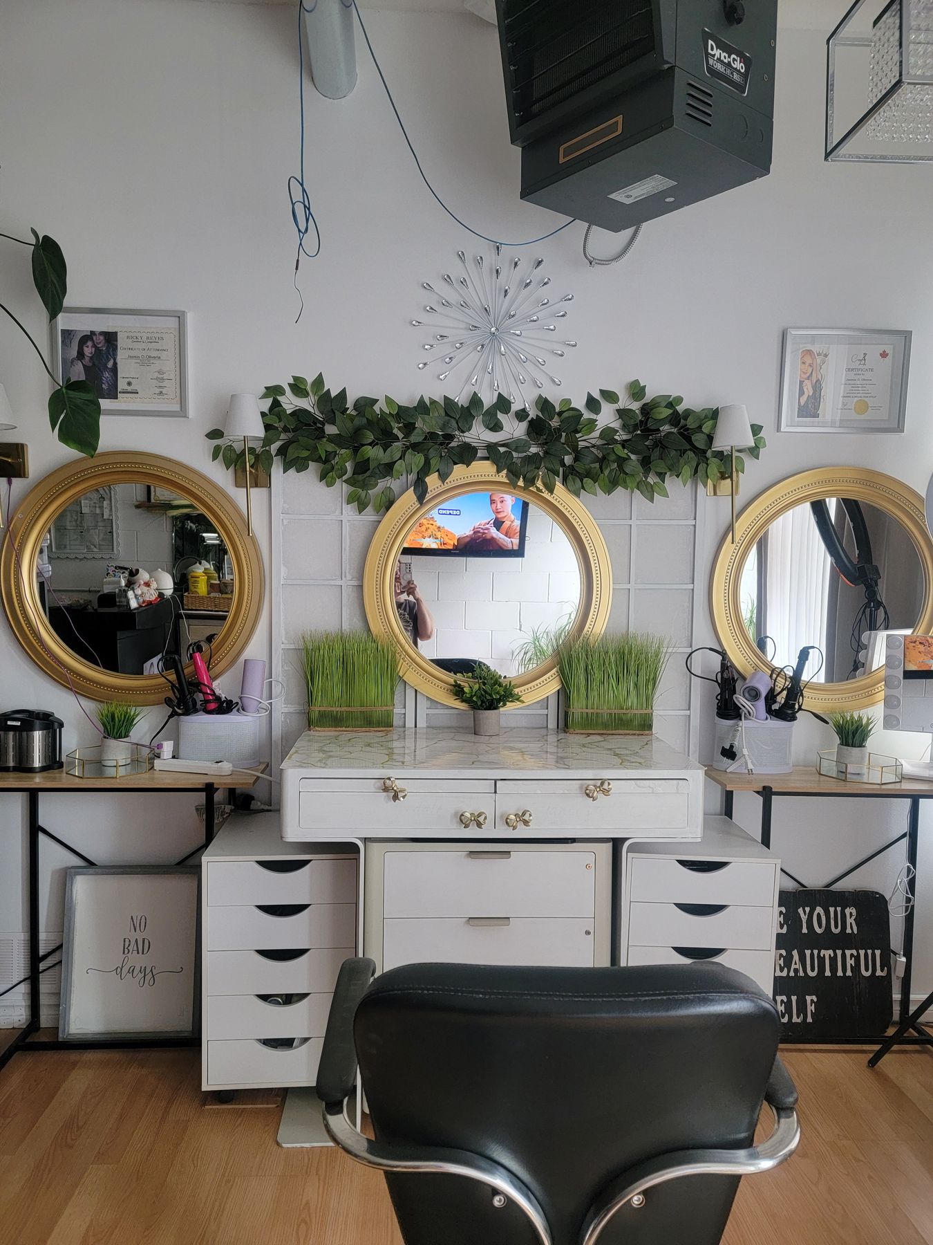 Styling station with round gold mirrors and fresh flowers